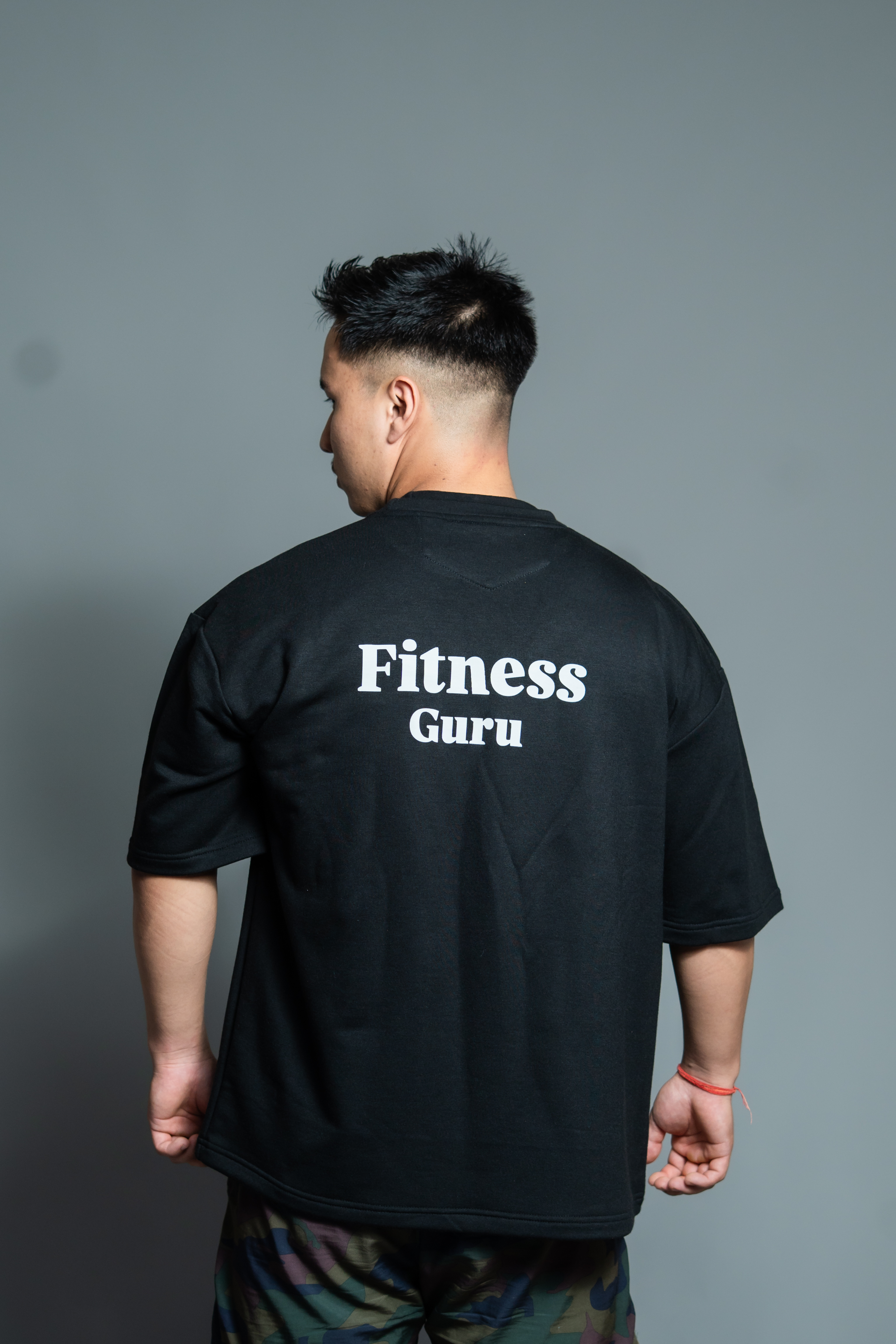 Kushal wearing the Fitness Guru wordmark